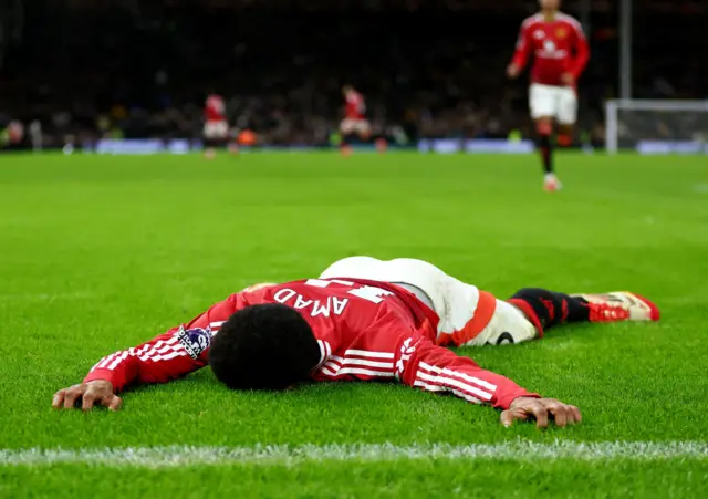 Amad Diallo of Manchester United celebrates after scoring a goal, which is later disallowed for offside,