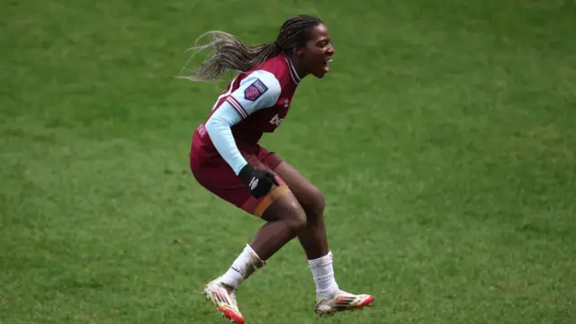 Viviane Asseyi of West Ham United celebrates scoring her team's second goal from the penalty spot during the Barclays Women's Super League match between West Ham United and Everton