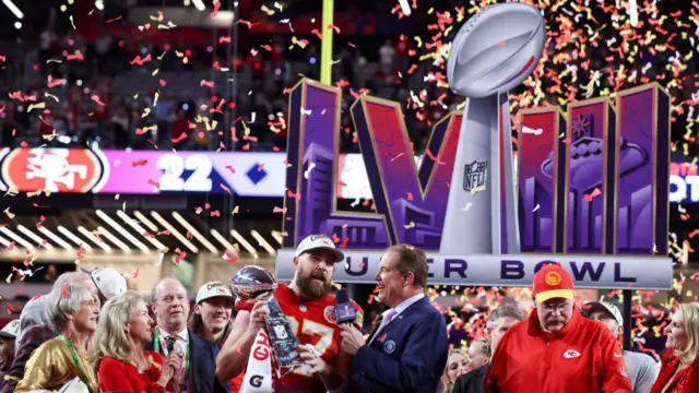 Travis Kelce celebrates with Lombardi Trophy