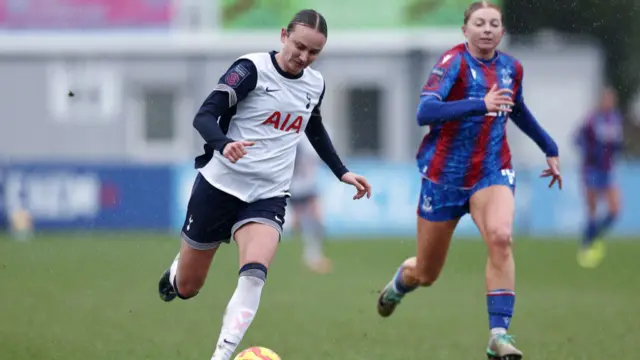 Martha Thomas of Tottenham Hotspur runs with the ball and is chased by Hayley Nolan of Crystal Palace during the Barclays Women's Super League match between Crystal Palace and Tottenham Hotspur FC