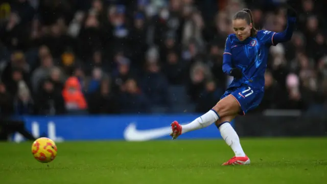 Guro Reiten of Chelsea scores her team's first goal from the penalty spot during the Barclays Women's Super League match between Chelsea FC and Arsenal FC