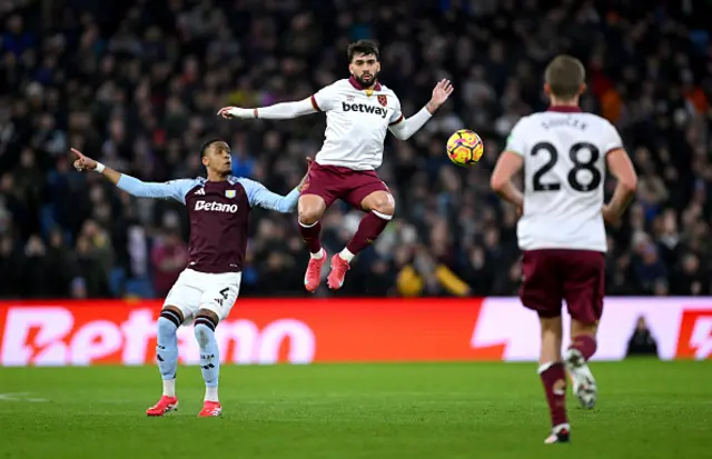 Lucas Paqueta of West Ham United is challenged by Ezri Konsa