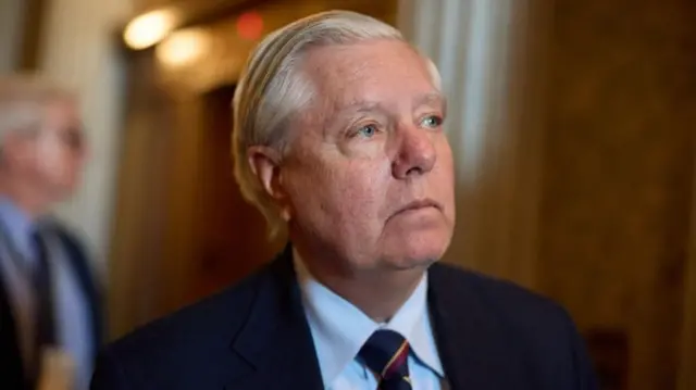 Republican Senator from South Carolina Lindsey Graham walks to the elevator after voting in the US Capitol in Washington