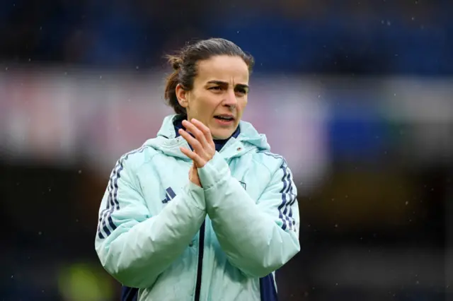 Renee Slegers, Manager of Arsenal, applauds the team as they warm up prior to the Barclays Women's Super League match between Chelsea FC and Arsenal FC at Stamford Bridge