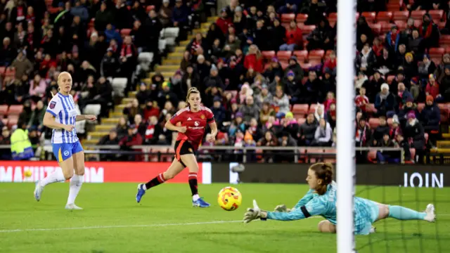 Ella Toone of Manchester United scores her team's first goal during the Barclays Women's Super League match between Manchester United and Brighton & Hove Albion