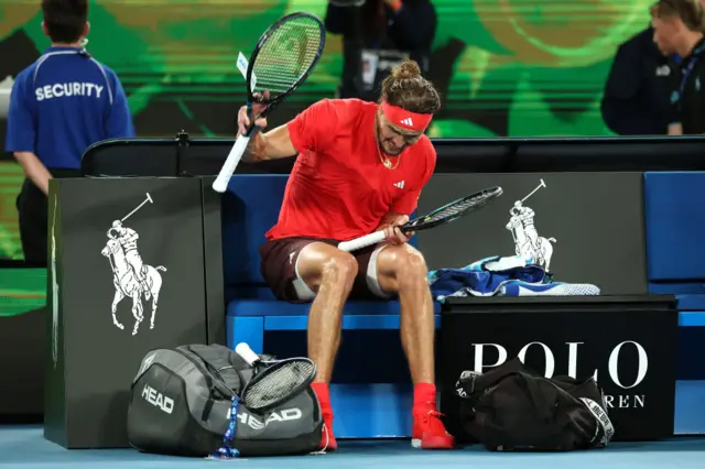 Alexander Zverev smashes his racquet