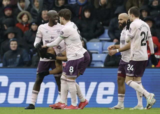 Brentford's Kevin Schade reacts with teammates after scoring