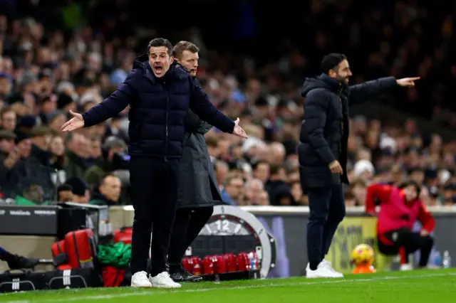 Marco Silva, Manager of Fulham, and Rueben Amorim, Head Coach of Manchester United, react