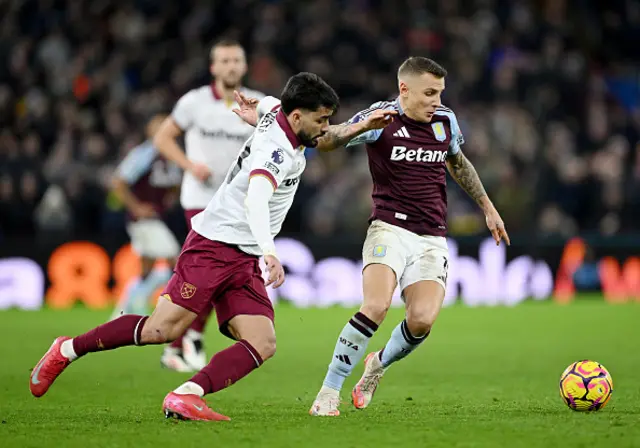 Lucas Digne of Aston Villa is challenged by Lucas Paqueta