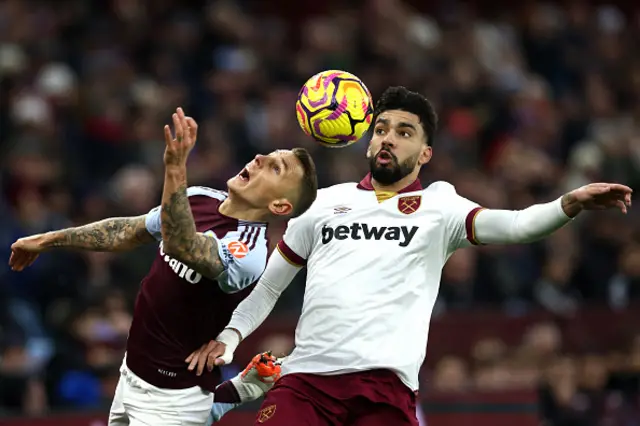 Lucas Digne battles for the ball with West Ham United's Brazilian midfielder #10 Lucas Paqueta