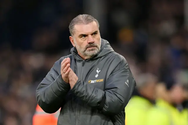 Ange Postecoglou, Manager of Tottenham Hotspur, acknowledges the fans