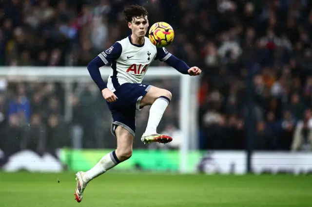 Archie Gray controls the ball.