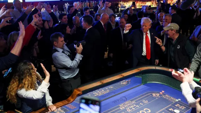 Donald Trump reacts near a craps table at the Circa Resort and Casino in Las Vegas, Nevada