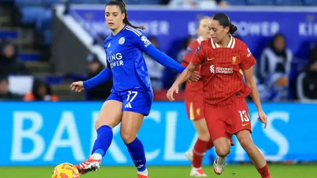 Julie Thibaud of Leicester City is put under pressure by Mia Enderby of Liverpool during the Barclays Women's Super League match between Leicester City and Liverpool FC