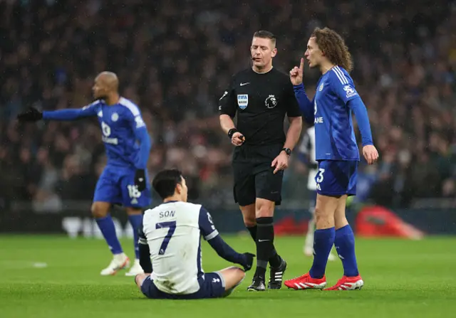 Wout Faes of Leicester City reacts towards referee Robert Jones