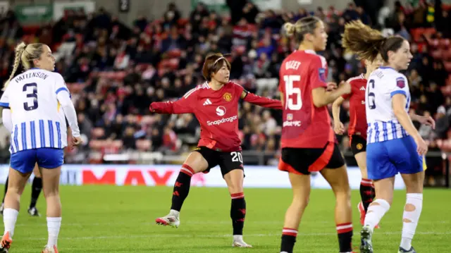 Hinata Miyazawa of Manchester United scores her team's second goal during the Barclays Women's Super League match between Manchester United and Brighton & Hove Albion