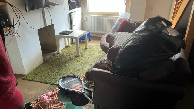 The view of a living room after it was damaged by floodwater