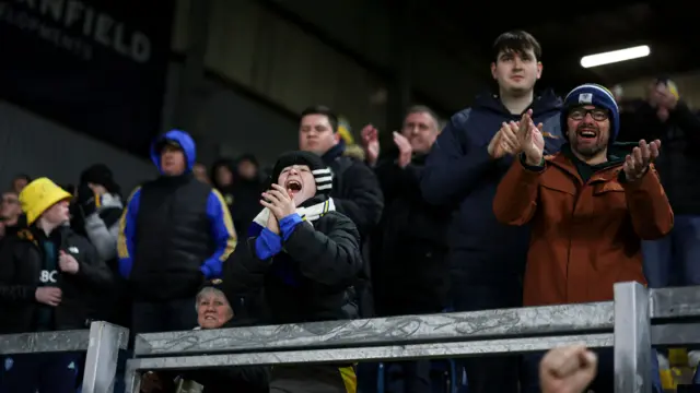 Leeds fans singing in the stands at Turf Moor