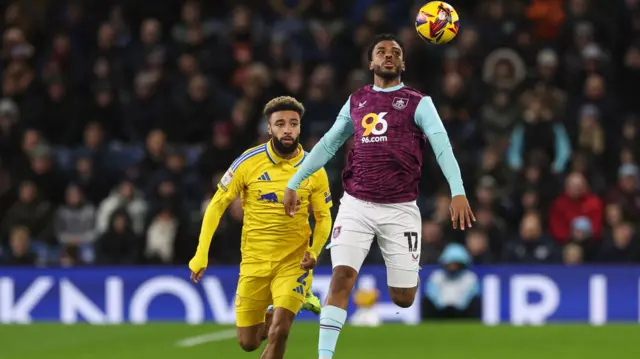 Jayden Bogle of Leeds battles with Burnley's Lyle Foster