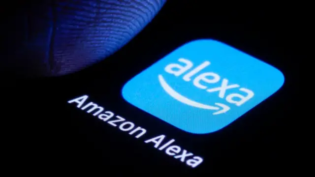 A [photo showing a phone with the mobile app Amazon Alexa