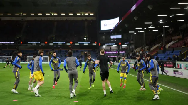 Leeds players warm up at Turf Moor