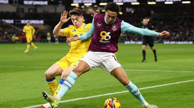 Burnley's Bashir Humphreys blocks off Leeds winger Dan James