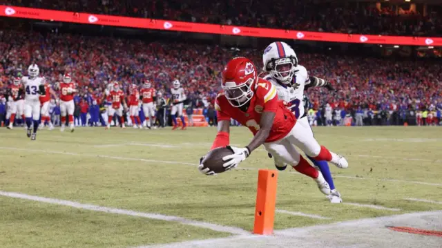 Xavier Worthy scores a touchdown against the Buffalo Bills