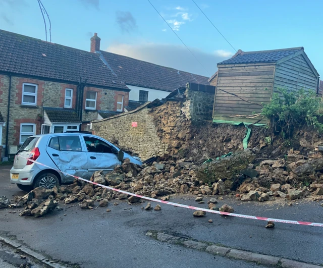 A car is pictured badly damaged in Ilminster