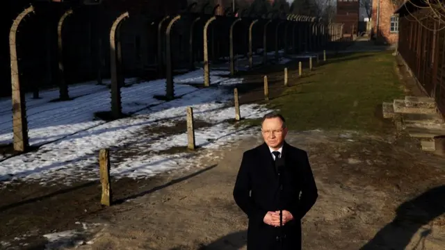 President Duda clasping his hands together