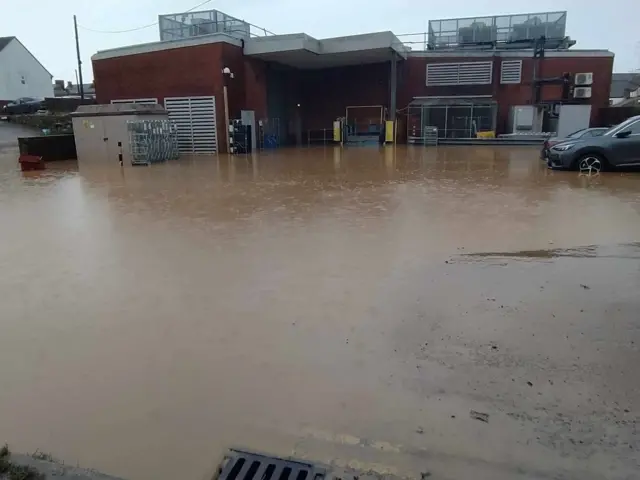 Floodwater at the back of a Sainsbury's building in Chard