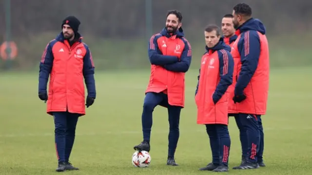 Ruben Amorim, Manager of Manchester United looks on with coaching staff