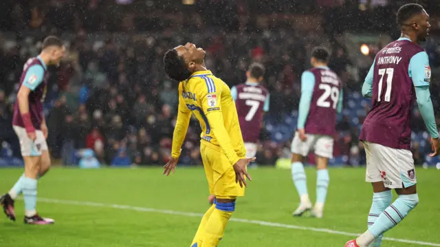 Leeds forward Largie Ramazani looks upwards and screams in anguish