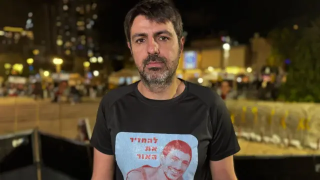 Michael Levy standing in Hostage Square in Tel Aviv