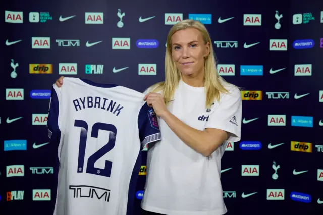 Josefine Rybrink holds a Tottenham shirt