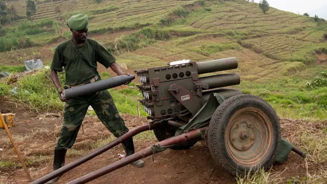 An M23 fighter loads ammunition