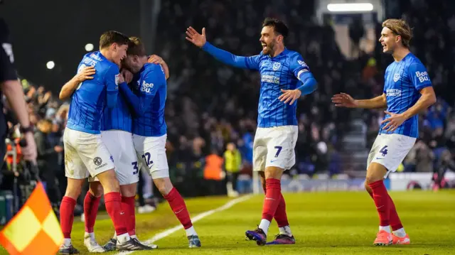 Portsmouth players celebrate a goal at Fratton Park