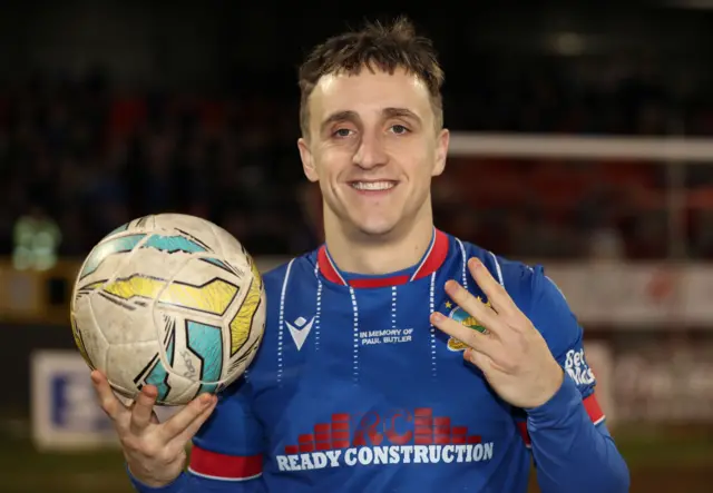 Joel Cooper with the match ball after a hat-trick