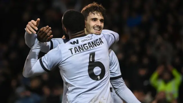 Millwall goalscorer Mihailo Ivanovic celebrates with Japhet Tanganga