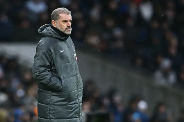 Ange Postecoglou wearing a coat