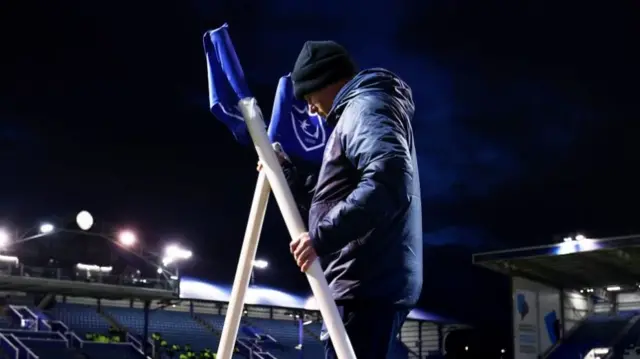 Corner flags being put in place at Fratton Park