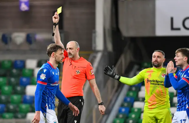 Matthew Fitzpatrick receives a yellow card for Linfield