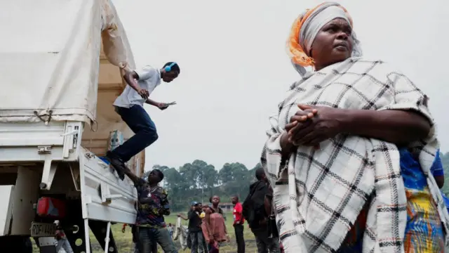 Congolese civilians who fled from Goma arrive at a reception centre in Rugerero near Gisenyi in Rwanda on 28 January