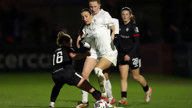 Rosa Kafaji of Arsenal is challenged by Emily Syme of Bristol City during The Adobe Women's FA Cup Fourth Round match between Arsenal and Bristol City