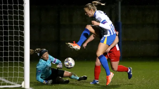 Guro Bergsvand of Brighton & Hove Albion scores her team's third goal during The Adobe Women's FA Cup Fourth Round match between Brighton & Hove Albion and Durham