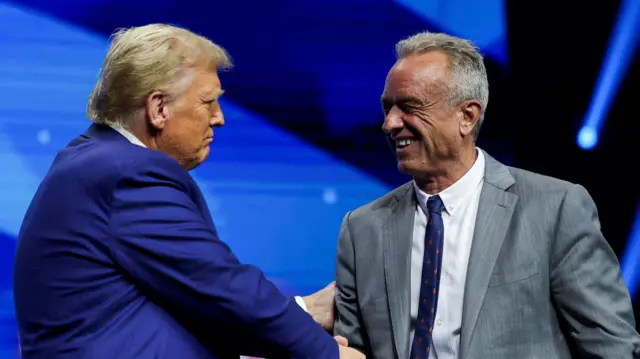 A file photo of Trump shaking hands with Robert F Kennedy Jr