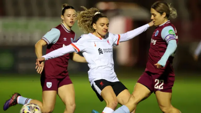 Leanne Kiernan of Liverpool is challenged by Katrina Gorry of West Ham United during The Adobe Women's FA Cup Fourth Round match between West Ham United and Liverpool