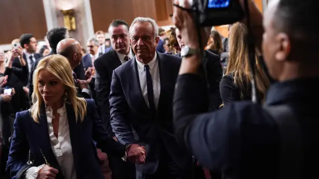 Robert F. Kennedy Jr and his wife Cheryl Hines attend a Senate Finance Committee confirmation hearing on Kennedy Jr.'s nomination to be Secretary of Health and Human Services, on