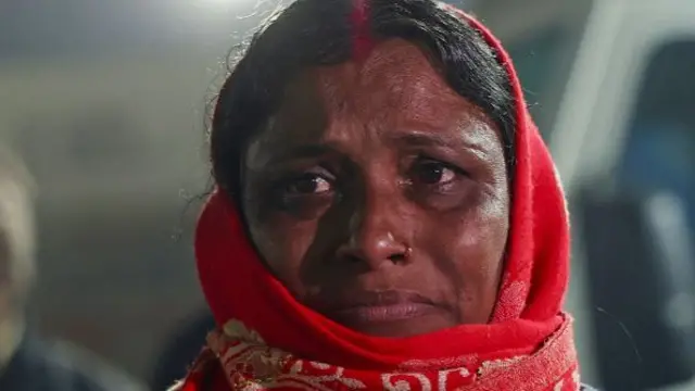 A pilgrim weeps outside the hospital after a stampede during Maha Kumbh Mela festival in Prayagraj on January 29, 2025