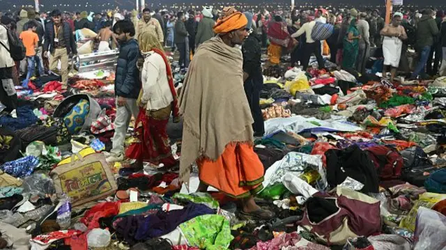 Pilgrims look for their belongings at the site of the crush