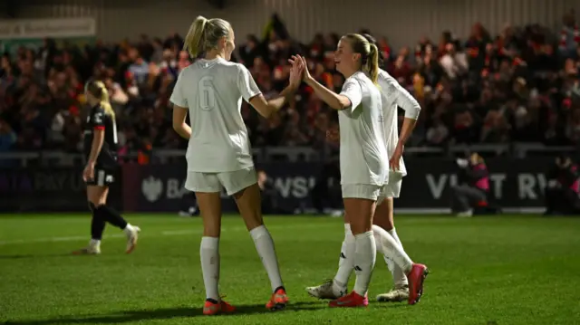 Beth Mead of Arsenal celebrates scoring her team's fifth goal with teammate Leah Williamson (obscured) during The Adobe Women's FA Cup Fourth Round match between Arsenal and Bristol City